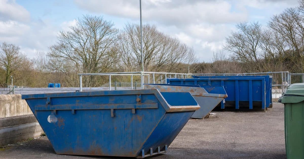 Recycling containers at a household waste recycling centre near Eastbourne